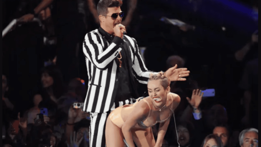 Miley Cyrus twerking on Robin Thicke