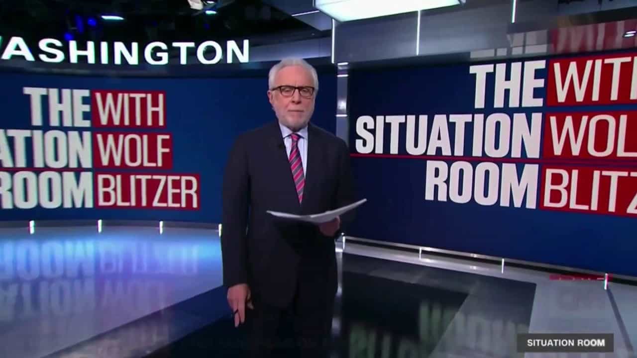 Wolf Blitzer as a tv news reporter in CNN