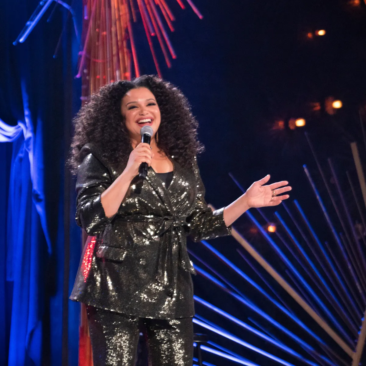 Michelle Buteau doing a stand-up comedy performance