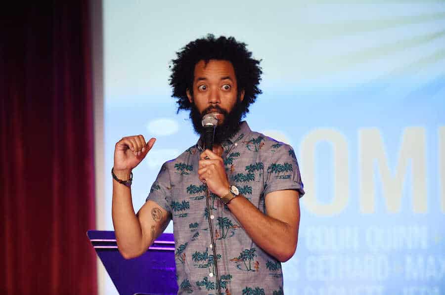 Wyatt Cenac performs stand-up comedy onstage